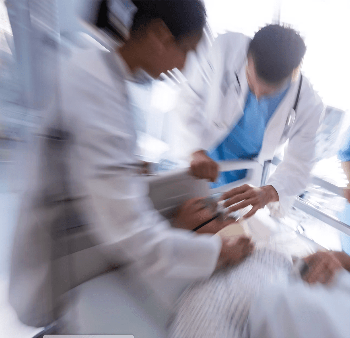 Clinical team providing urgent patient care at the bedside